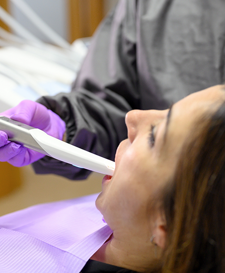 Dental patient having digital scans of her teeth taken
