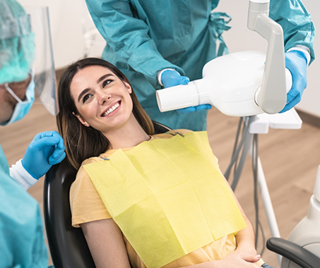 Woman in the dental chair listening to her dentist