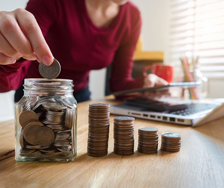 Person sorting change into piles