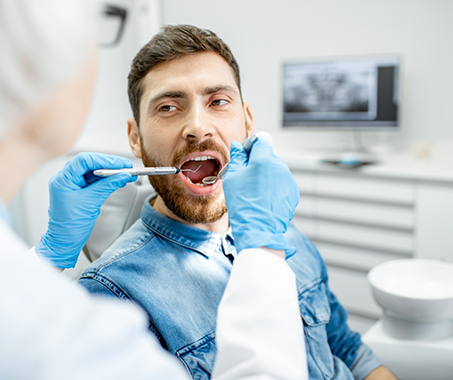 Man receiving a dental exam