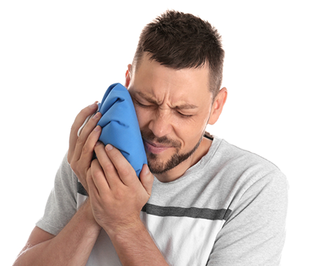 Man holding an ice pack to his cheek