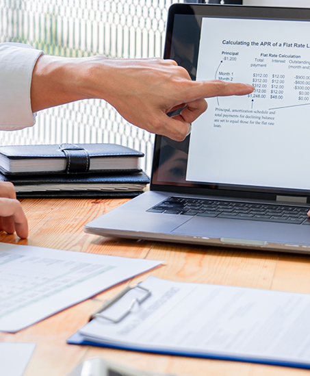 Person looking at financing information on a laptop