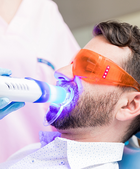 Dental patient getting professional teeth whitening
