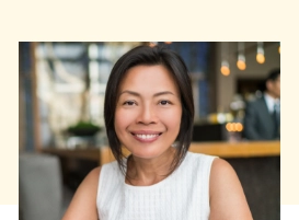 Woman smiling at a restaurant table