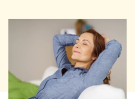 Woman relaxing with her hands behind her head