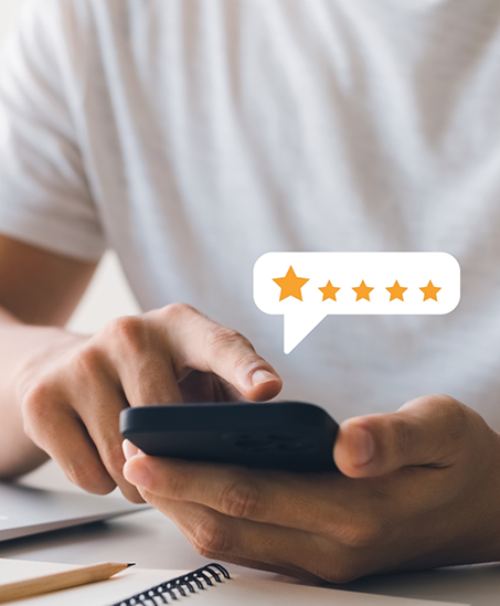 Person leaving a five star review on their phone