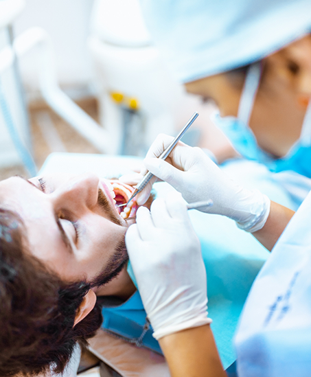 Dentist performing a tooth extraction