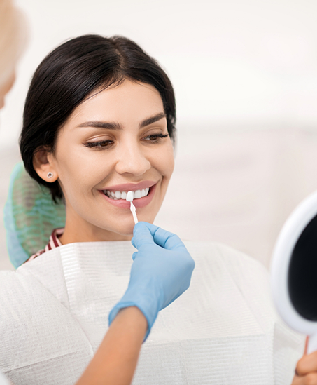 Dentist fitting a patient for veneers in Goodyear