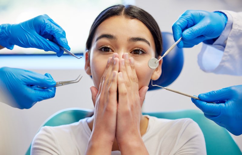 A woman experiencing a dental phobia