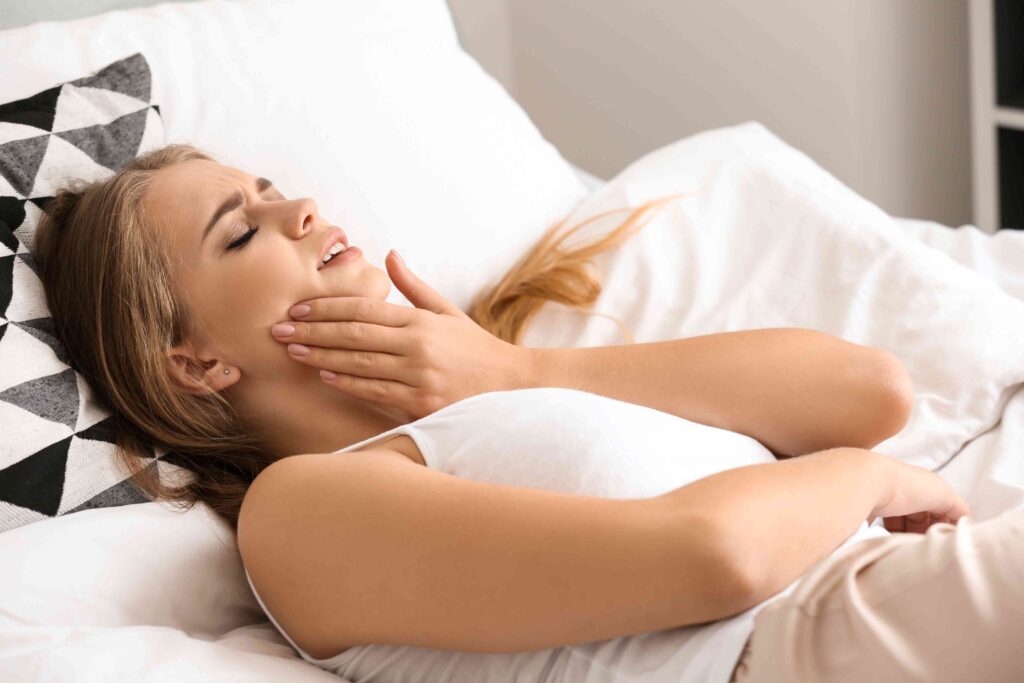 Woman awake after grinding her teeth