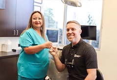 Doctor Goodman giving a fist bump to a team member